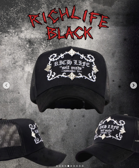 Black trucker cap with a white embroidered baroque frame and self made lettering reading Richlife.