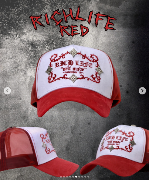 Red and white trucker cap with a red embroidered baroque frame and self made lettering reading Richlife.